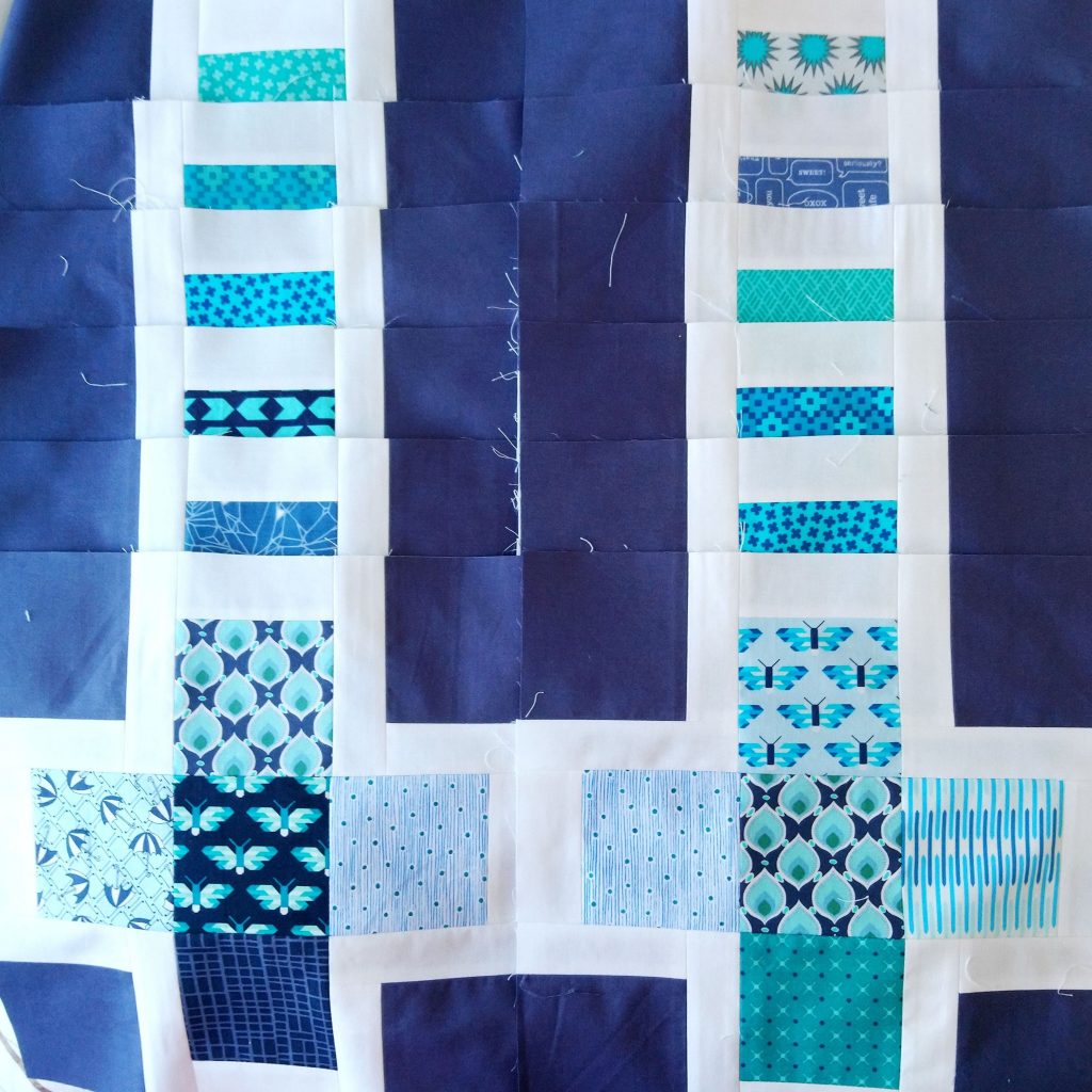 Blocks for Hugo's Quilt laid out in 2 rows.