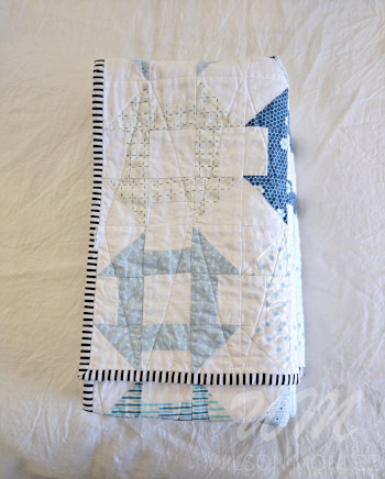 Folded churn dash quilt from above